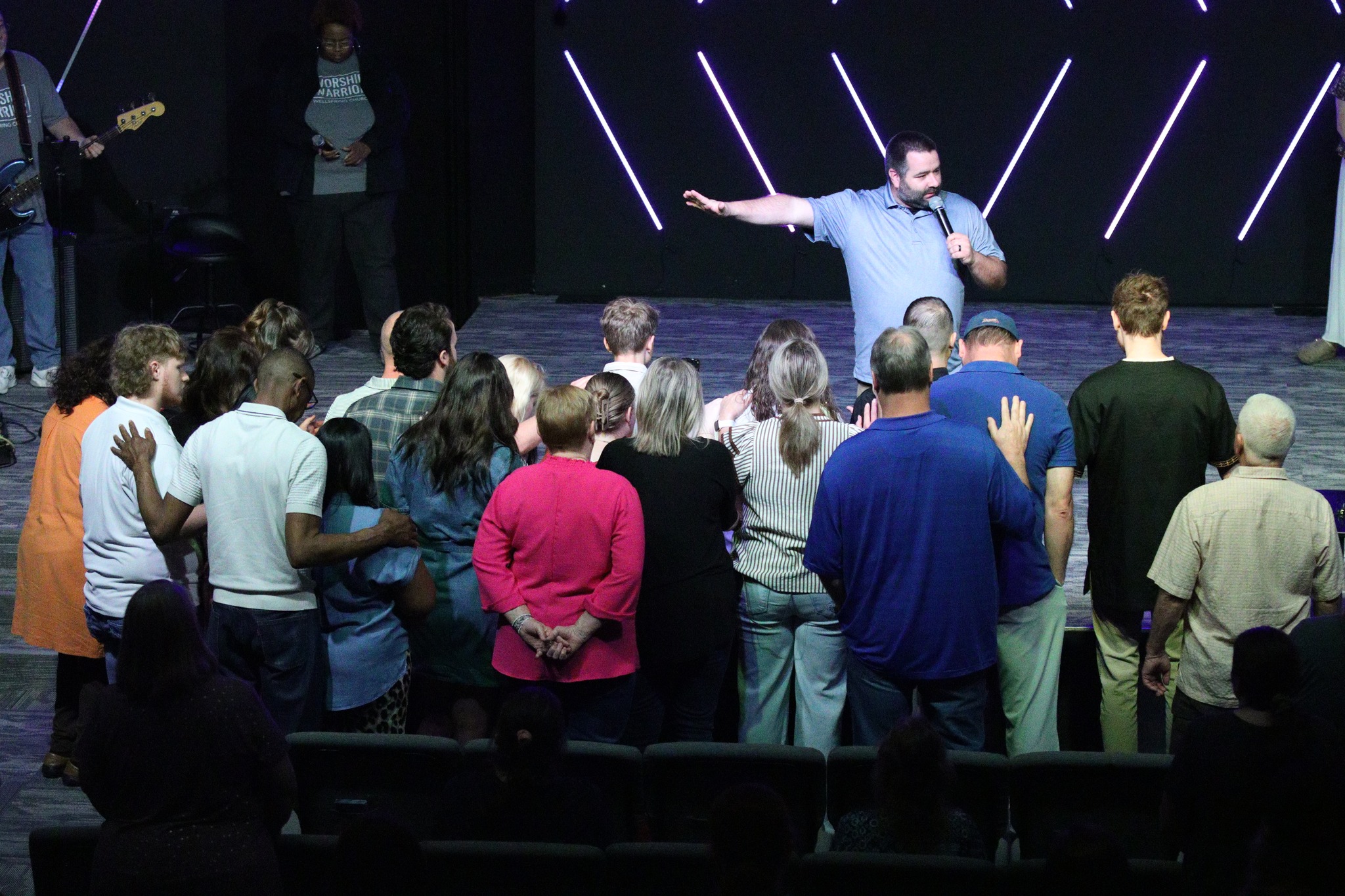 Prayer at the front of Wellspring Church service